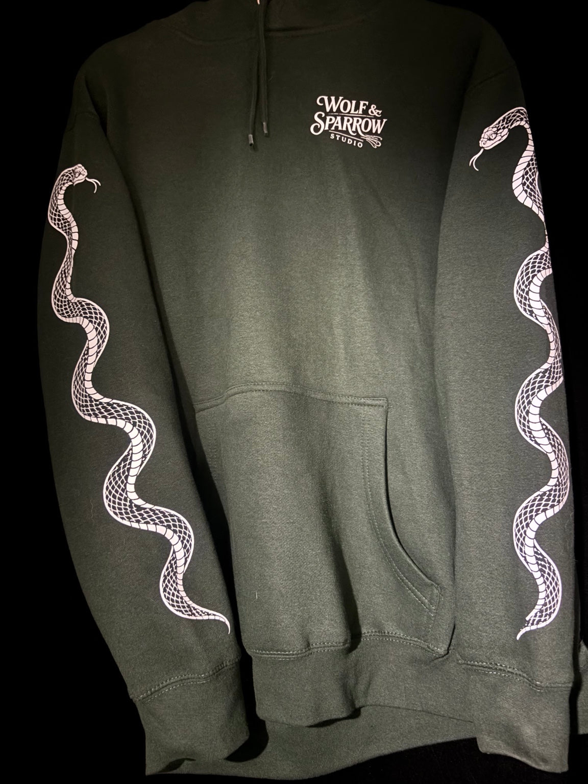 Wolf & Sparrow Studio “Medusa Girl” Hoodie front and snake sleeves in Sport Green